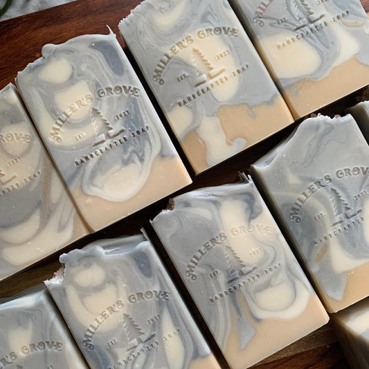 White, light blue, dark blue and beige swirly soap bars.