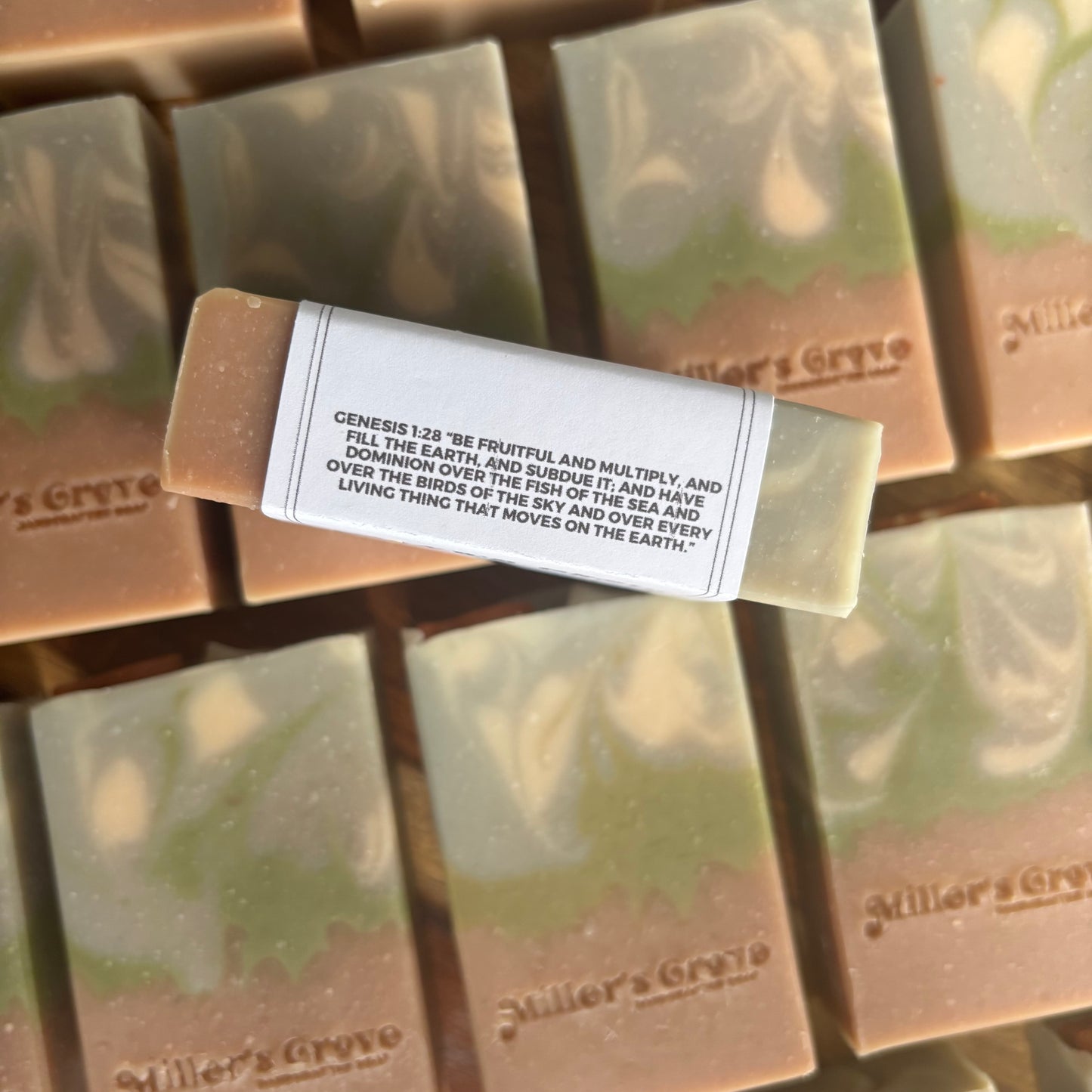 Bar of soap with a label on a reflective surface