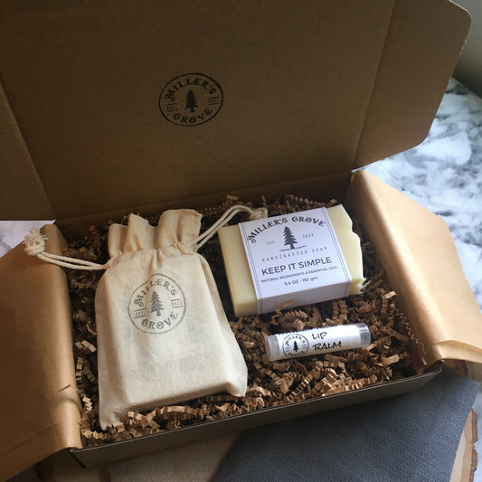 example of items in a brown gift box with brown crinkle paper