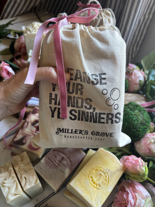 Product with 'Cleanse your Hand's Ye Sinners' branding and 'Miller's Grove' soap in the background.