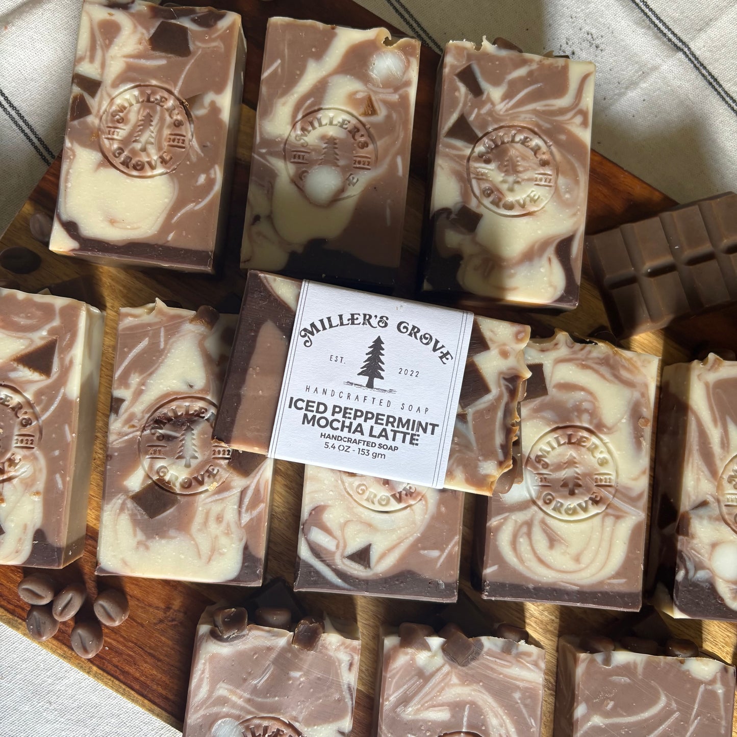 Collection of miller's Grove soap bars on a wooden board with a label.