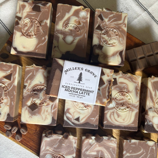 Collection of miller's Grove soap bars on a wooden board with a label.