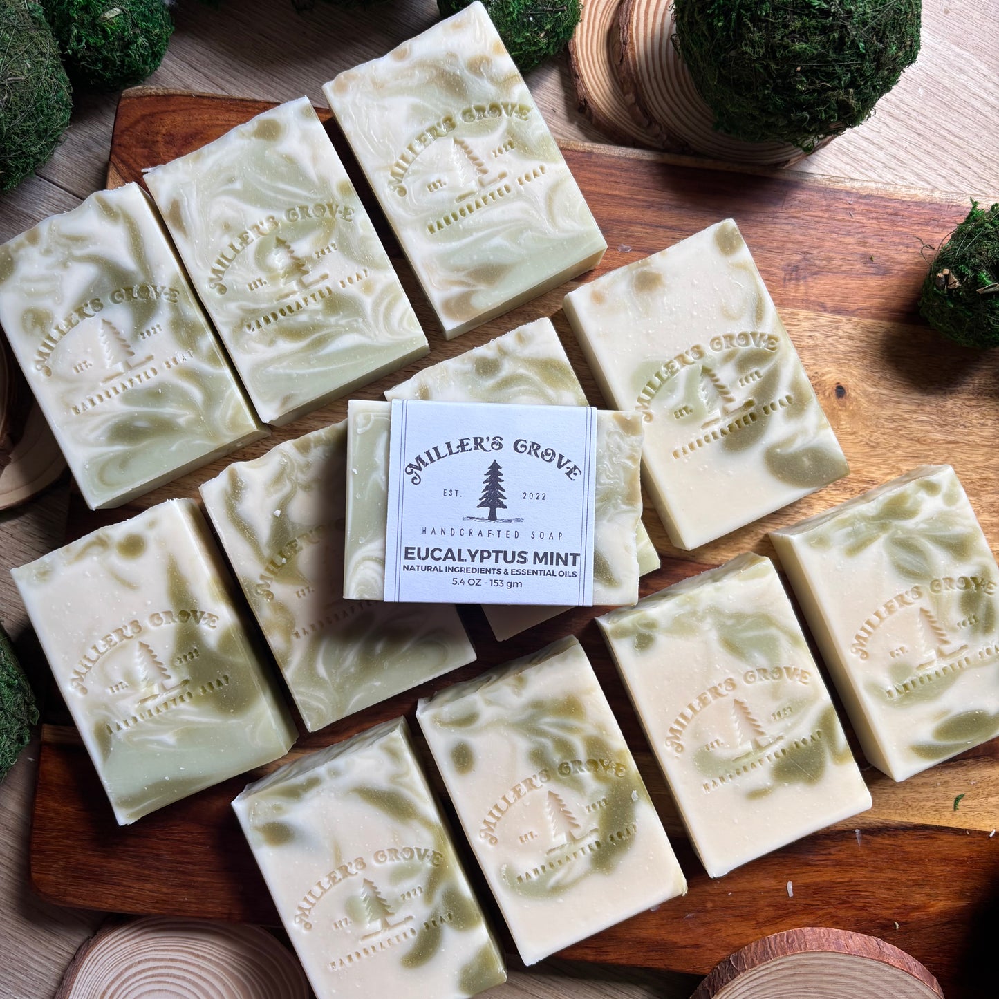  soap bars with 'Miller's Grove' branding on a wooden surface.