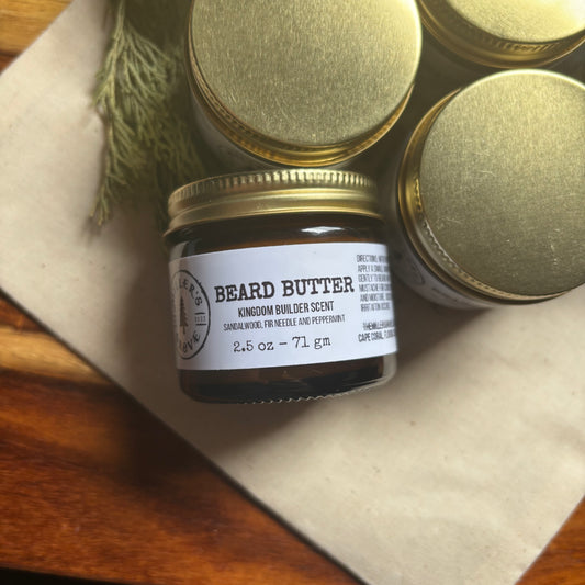 Jar of beard butter with a label on a wooden surface