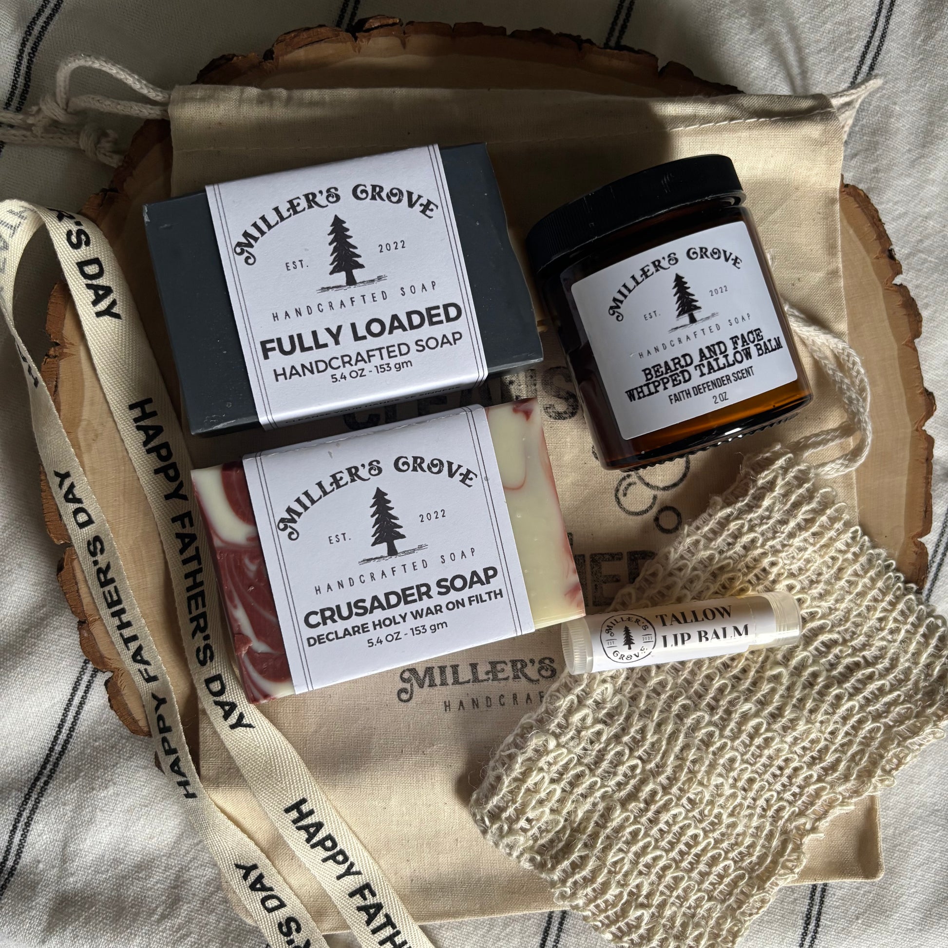 Miller's Grove soap and body wash set on a textured surface with 'Happy Father's Day' ribbon.